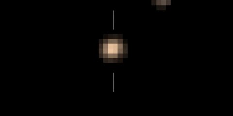 НАСА опубликовало первое цветное видео Плутона и его спутника